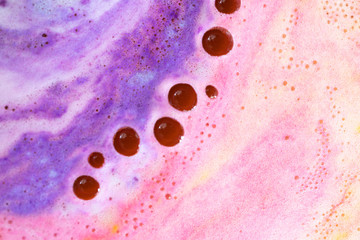 Foam with round bubble of bath bomb close-up colorful texture