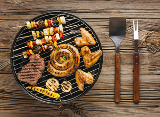 High angle view of delicious grilled meat with vegetable over the coals on a barbecue