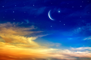 Fototapeta na wymiar Generous Ramadan . New moon . Red sunset and moon . cloudy landscape and star sky . 