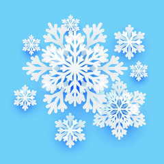 Winter paper snowflakes on blue background for Your holiday design