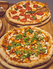 Pizza and other dishes on the wood table food style