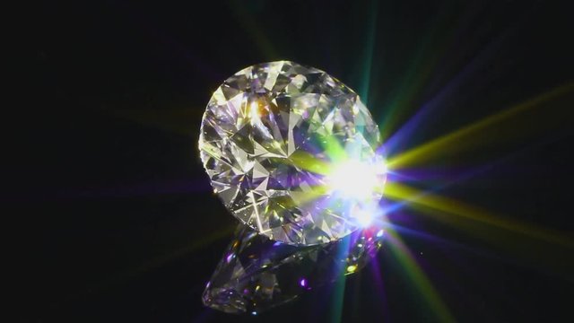 View of a sparkling diamond on a black background (close-up)