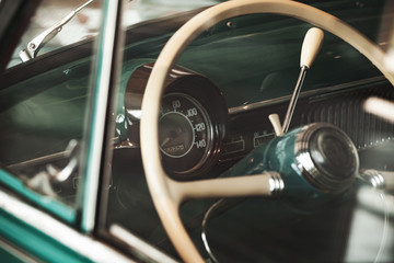Retro car steering wheel and dashboard