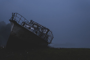 abandoned ship ashore in the fog