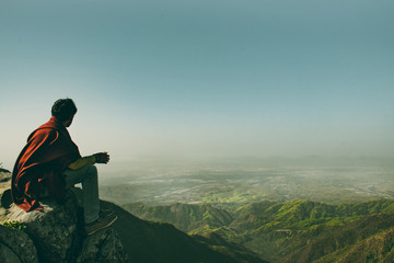 Fototapeta premium Silhouette of a man on top of mountain