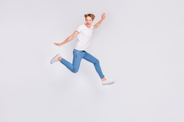Fototapeta na wymiar Full body profile photo of jumping high guy feel himself lightweight wear casual outfit isolated white background