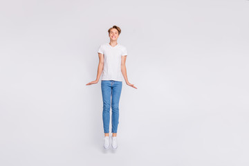 Full length photo of attractive guy jumping high in air wear casual outfit isolated white background