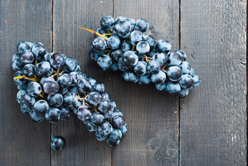 red grape on black wooden table