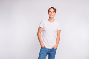 Photo of amazing guy hold hands pockets wear casual outfit isolated on white background