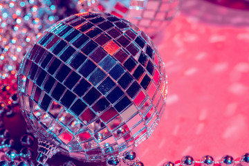 Mirror disco balls over pink background. Party, nightlife concept