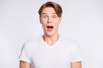 Close-up portrait of his he nice cute attractive cheerful cheery glad guy expressing wow opened mouth isolated over light white pastel background