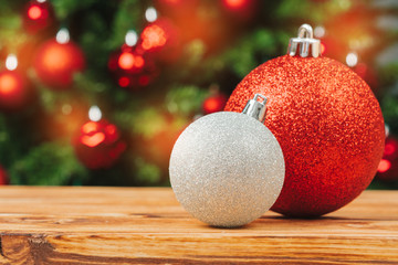 Christmas fur-tree decorations on wooden table close up