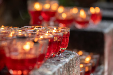 Traditional glass candles burning at Chùa Ngọc Hoàng temple in Saigon, vietnam