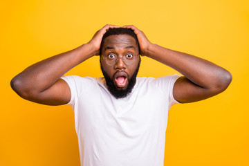 Photo of frightened african man having noticed her brother arguing with most evil old woman of their district while isolated with yellow background