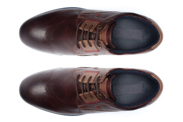 Classic male leather shoes isolated on a white, top view.