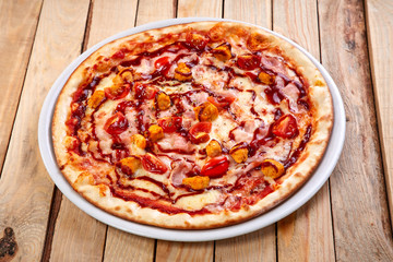 italian pizza on the wooden background