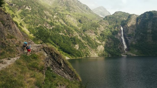 Beautiful drone shot of a waterfall in Pyrenee, Lac d'Oô, Landscape in the french mountains.