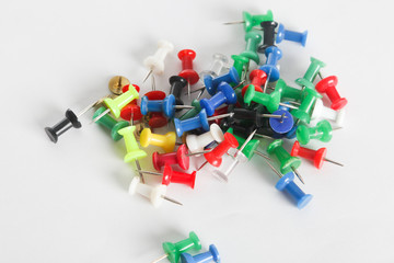 Colorful thumb tack on the white background
