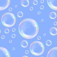Seamless pattern with realistic transparent floating soap bubbles with rainbow reflection. Design element for advertising booklet, flyer or poster