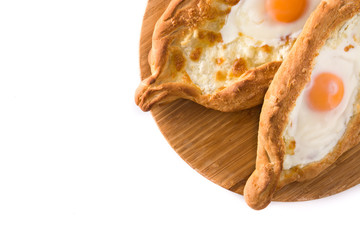 Traditional Adjarian Georgian khachapuri with cheese and egg isolated on white background. Top view. Copyspace
