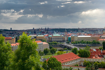 Fototapeta na wymiar Scenic panoramic view of historical center of Prague,bridges and Vlatva river on a cloudy day