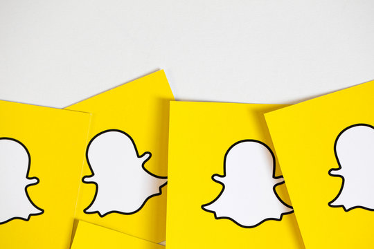 OXFORD, UK - DECEMBER 5th 2016: Snapchat logos printed onto paper. Snapchat is a popular social media application for sharing messages, images and videos
