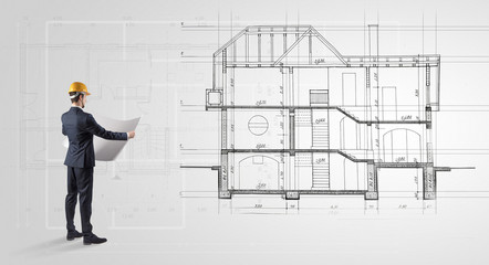 Architect watching a 2 dimension house plan