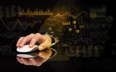 Hand using wireless mouse with financial concept on dark background