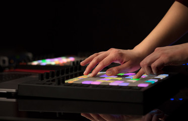 Fototapeta premium Dj hand remixing music on midi controller