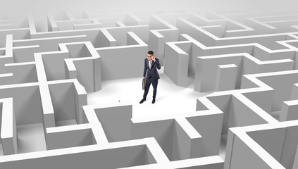 Young businessman standing in a middle of a 3D maze
