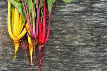 Harvest of colored chard (Beta vulgaris) on a wooden table. Agricultural concept, harvest season