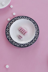 Pills in the dish. Concepts - what we eat, hidden ingredients, addictions.