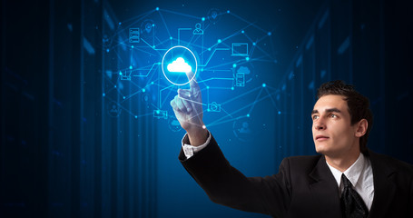 Man touching hologram projection displaying cloud system