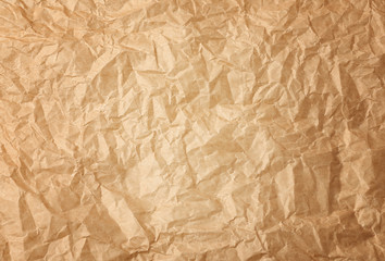 crumpled brown baking parchment paper, full frame
