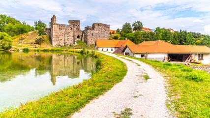 Fototapeta na wymiar Borotin Castle ruins with romantic pond in the foreground, Borotin, South Bohemia, Czech Republic