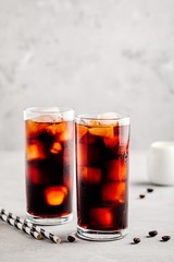 Homemade iced coffee with ice cubes in tall glasses