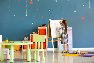 Obraz premium Little girl with autistic disorder in playroom