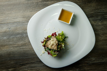 top view on tasty caesar salad with rubbed cheese and sauce