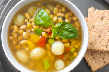Tasty soup with legumes in bowl, closeup