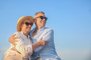 Happy mature couple at sea resort