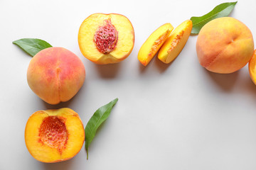 Ripe peaches on light background