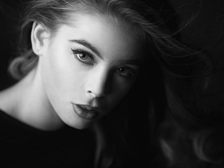 Black and white portrait of a girl made in studio