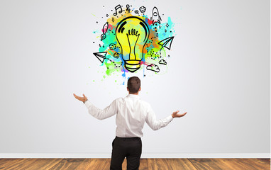 Businessman looking to a wall with new idea concept