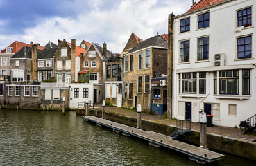 Fototapeta na wymiar Houses for living around the canal in Dordrecht