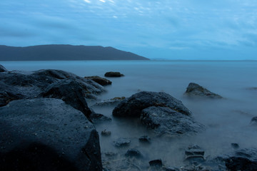 Obraz premium Islands and Sea with Sunset in the Background
