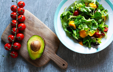 Organic salad made of vegetable placed on wooden board