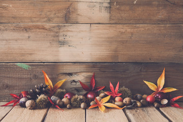 autumn tinker figures on wooden background