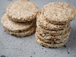 Rice and buckwheat cakes on the grey table