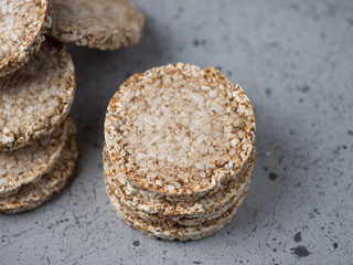 Rice and buckwheat cakes on the grey table