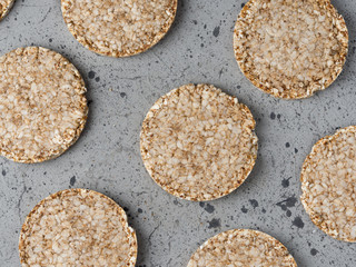 Rice and buckwheat cakes on the grey table